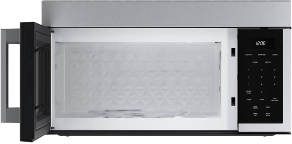 Open left side door of stainless steel over-the-range microwave with digital control panel in kitchen appliances collection
