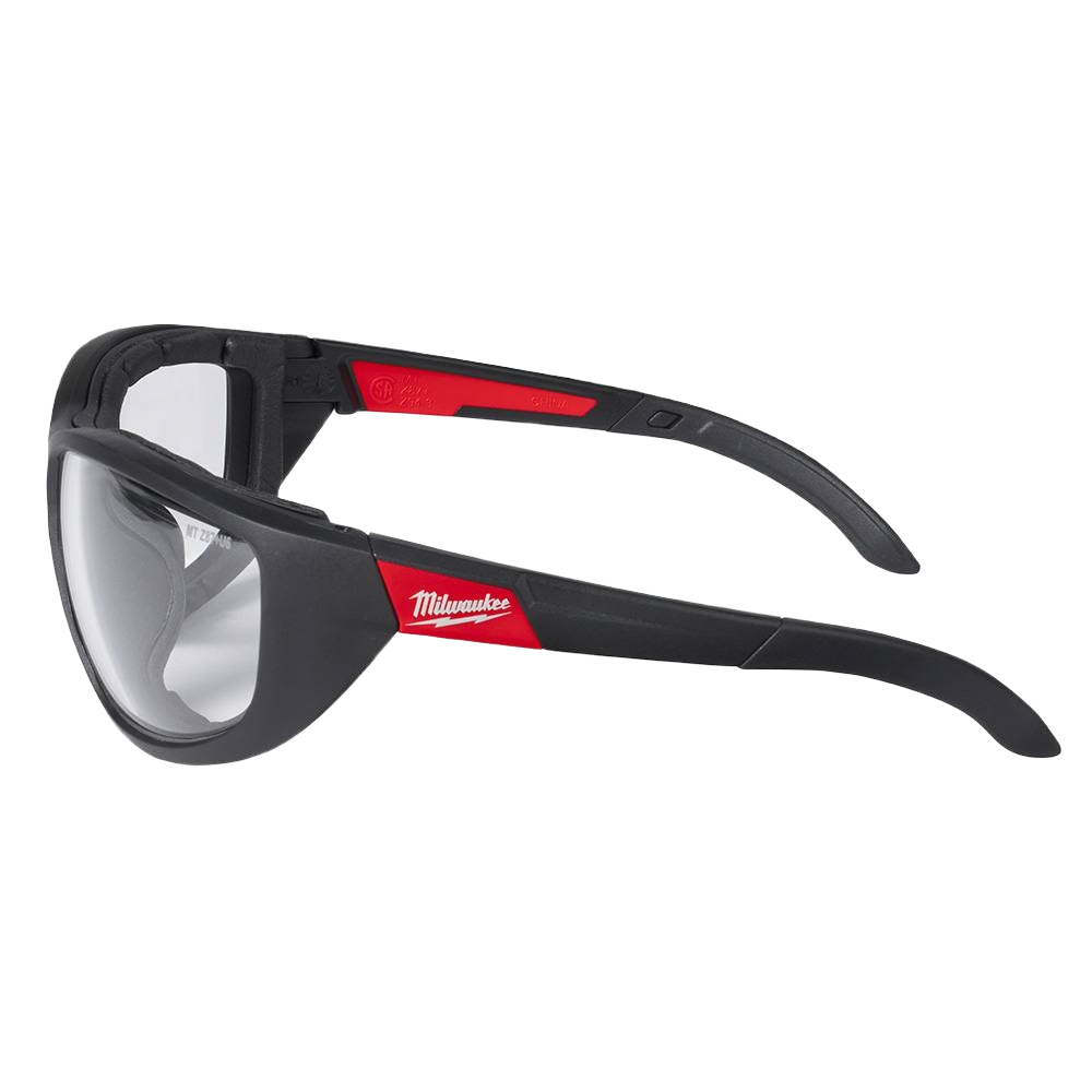 Clear lens safety glasses with black and red frame and gasket for impact protection in tools and home improvement tasks