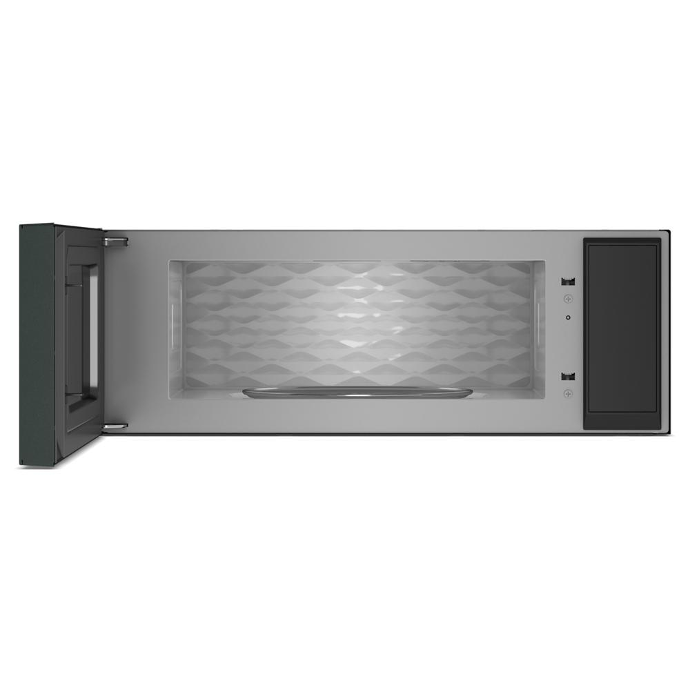 Interior view of a stainless steel microwave hood with textured back panel and open door for kitchen appliances collection