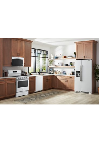Modern kitchen with wood cabinetry, white appliances including gas range, dishwasher, microwave, and refrigerator