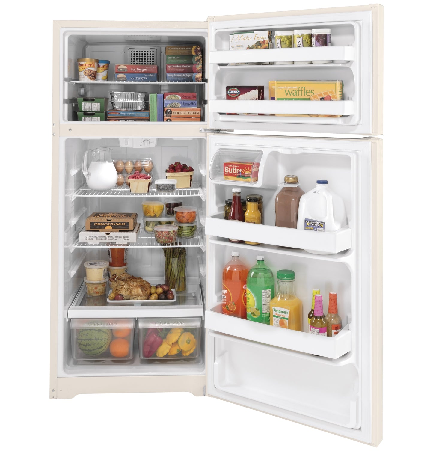 Open cream-colored top freezer refrigerator filled with groceries in kitchen appliances and refrigerators collection