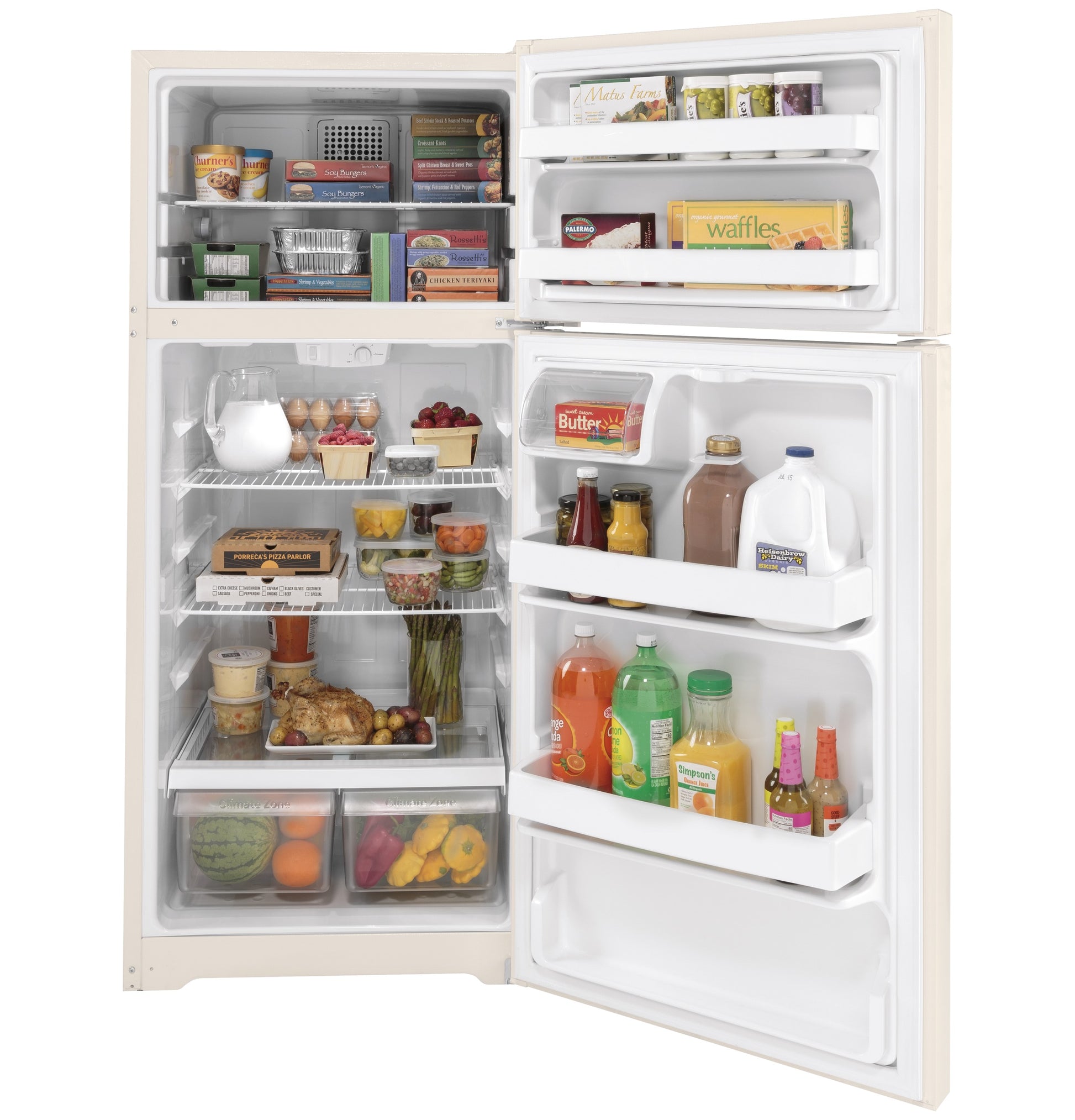 Open cream-colored top freezer refrigerator filled with groceries in kitchen appliances and refrigerators collection