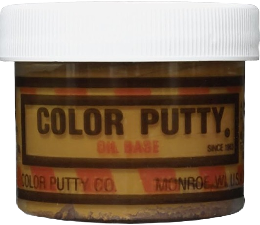 Small container of honey oak color putty oil base wood filler for furniture and home improvement repair tasks