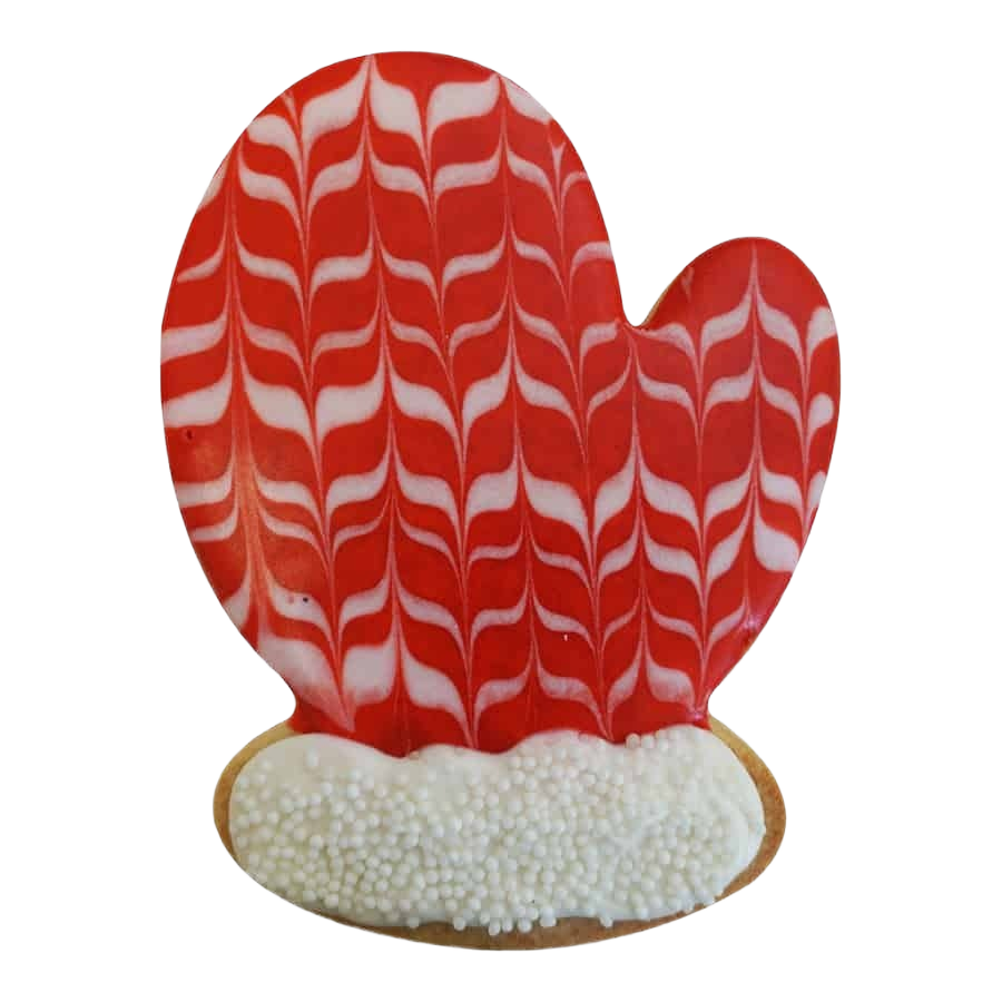 Red and white patterned mitten-shaped cookie decorated with icing and white sprinkles, kitchenware and bakeware accessory