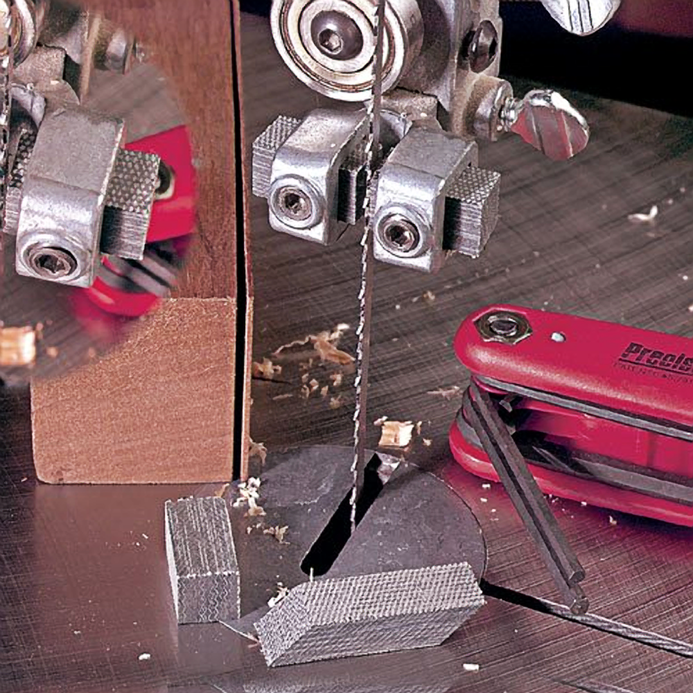 Graphite cool blocks positioned around bandsaw blade for improved cutting control in woodworking tool accessories collection