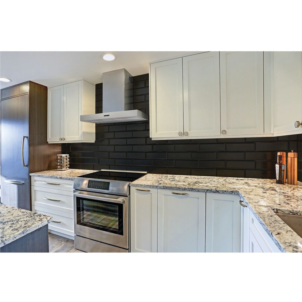 Modern kitchen featuring a stainless steel convertible T-style wall mount chimney hood with bright LED lighting and granite countertops