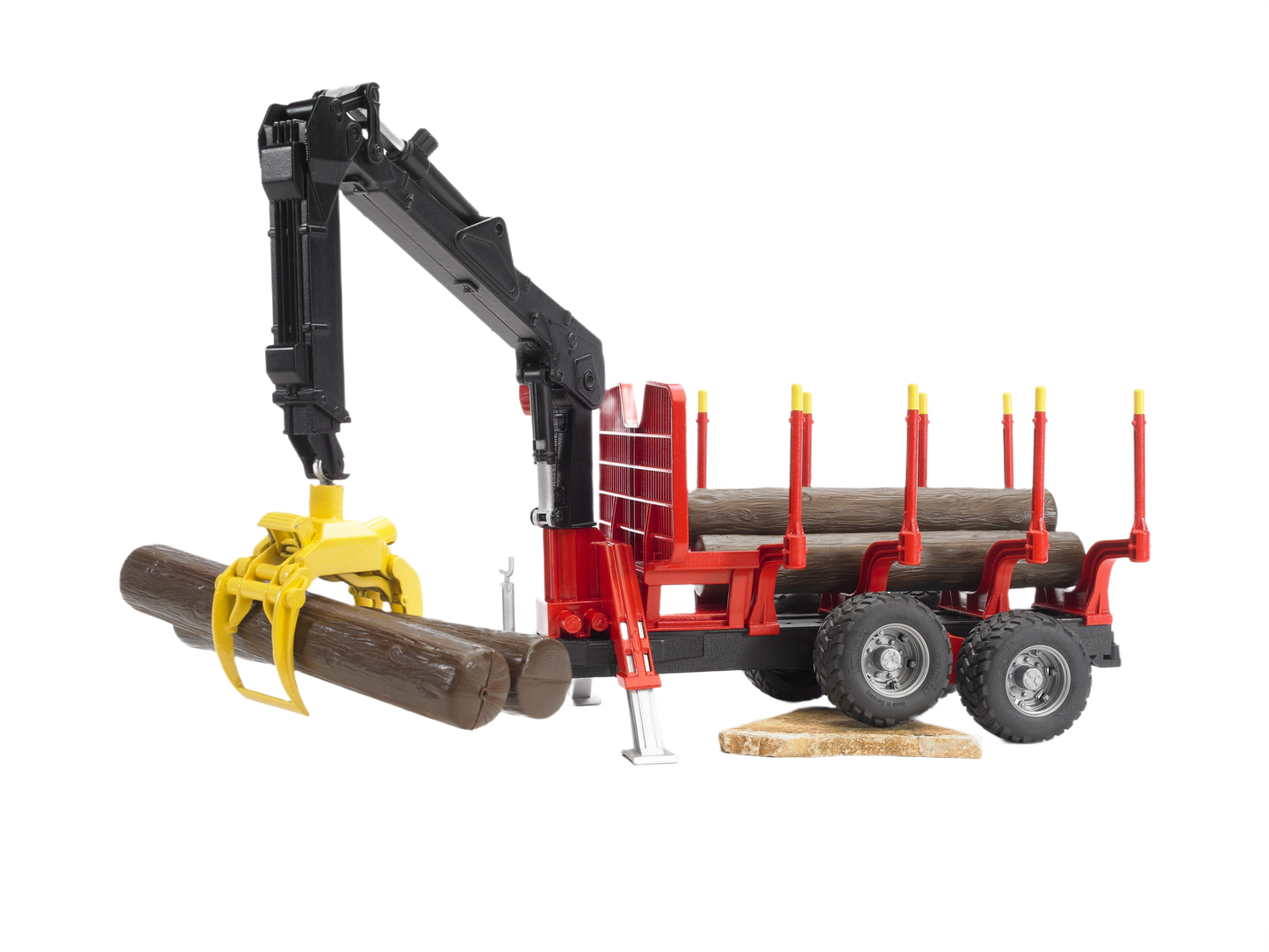 Red and black forestry trailer toy with yellow grapple lifting logs, part of Bruder Toys in Vehicles & Remote Controlled Toys collection