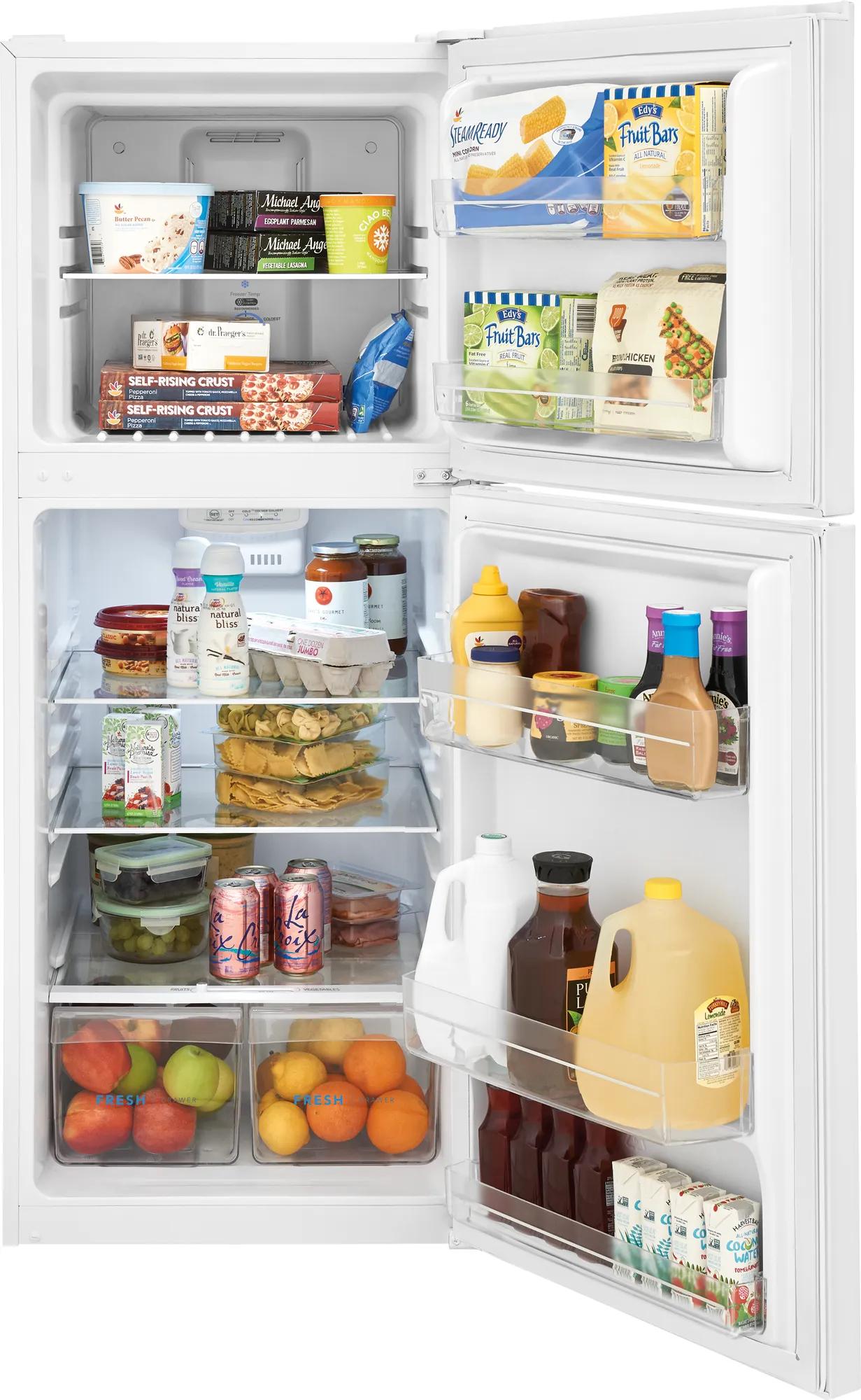 Open white top freezer refrigerator filled with assorted food and beverages in kitchen appliances collection