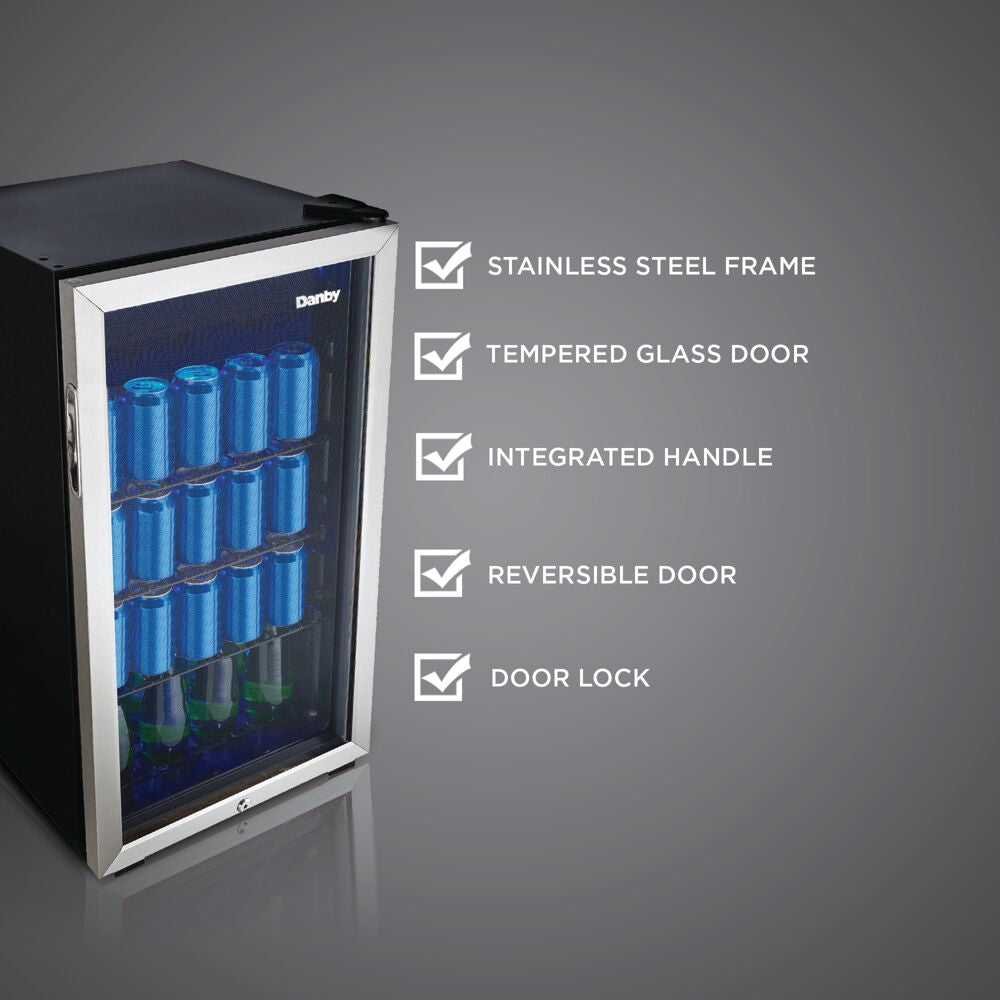 Compact beverage fridge with stainless steel frame, tempered glass door, wire shelves stocked with blue cans and green bottles