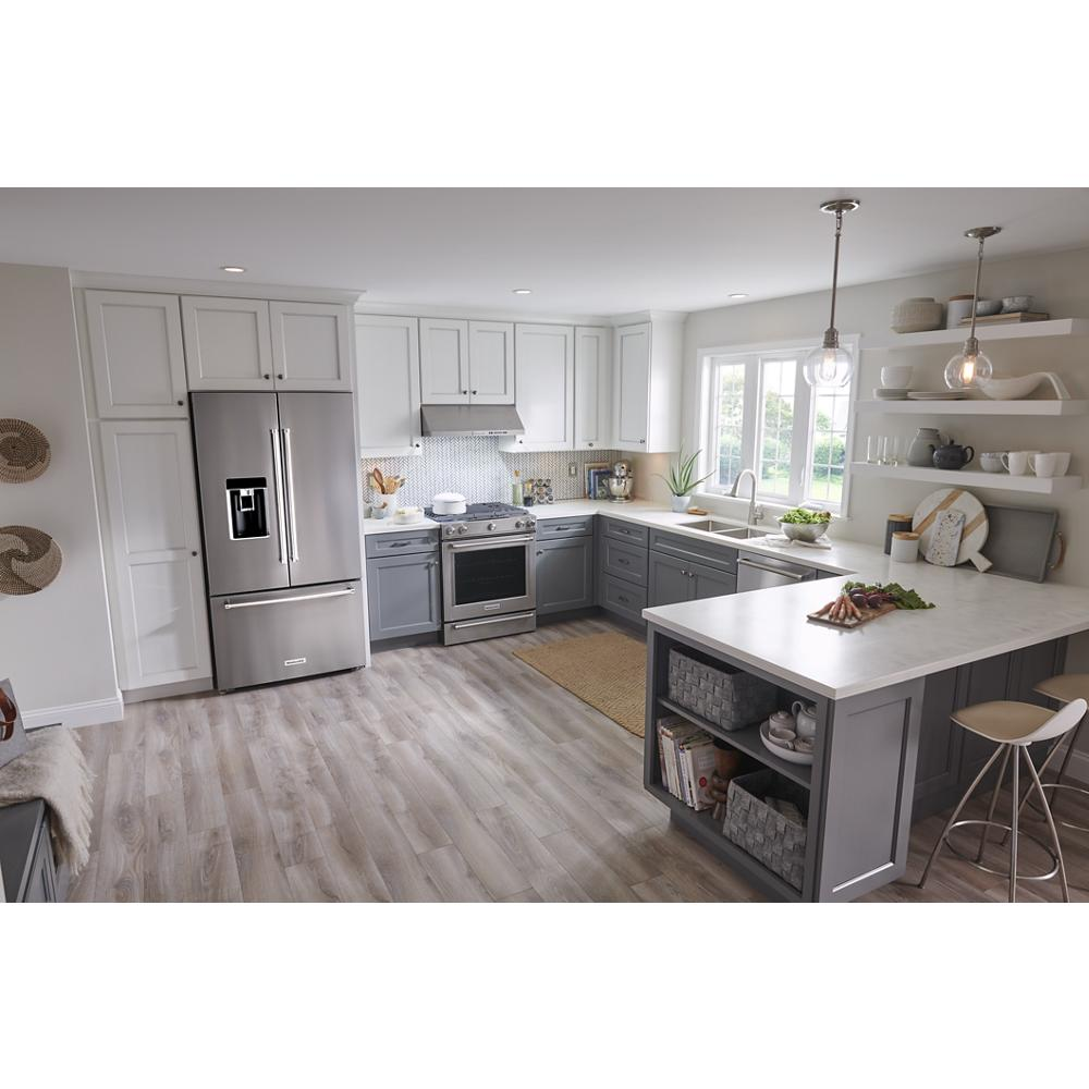 Modern kitchen with gray and white cabinetry, stainless steel appliances, bright natural lighting, and spacious island with seating and open shelving