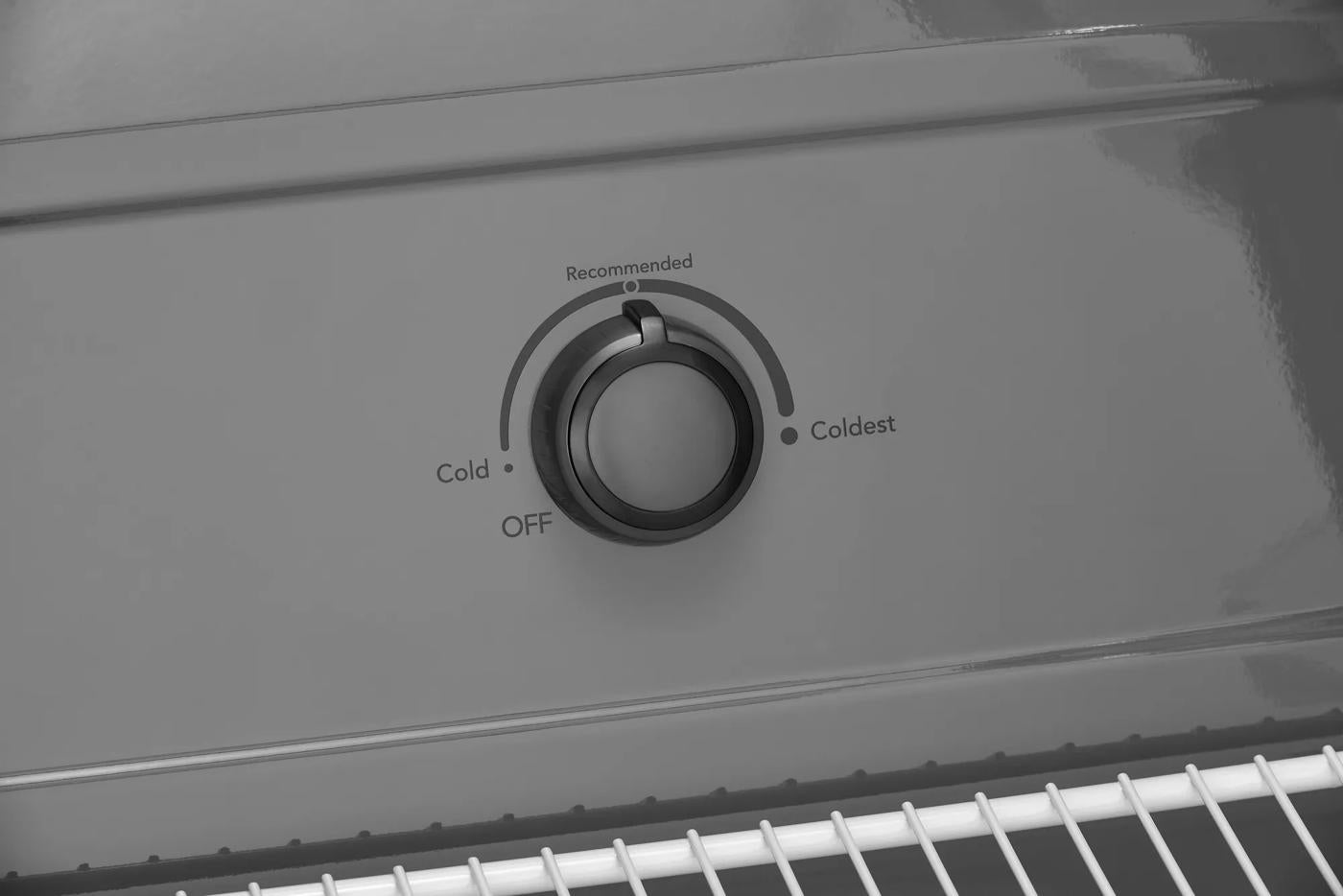 Close-up of a temperature control dial with settings from Off to Coldest inside an upright freezer for Freezers & Ice Makers and Appliances collections.