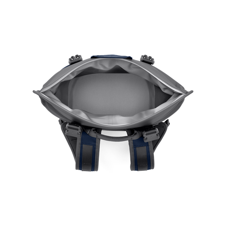 Top-down view of insulated interior in navy and gray YETI Hopper M12 Backpack Soft Cooler for food storage and organization