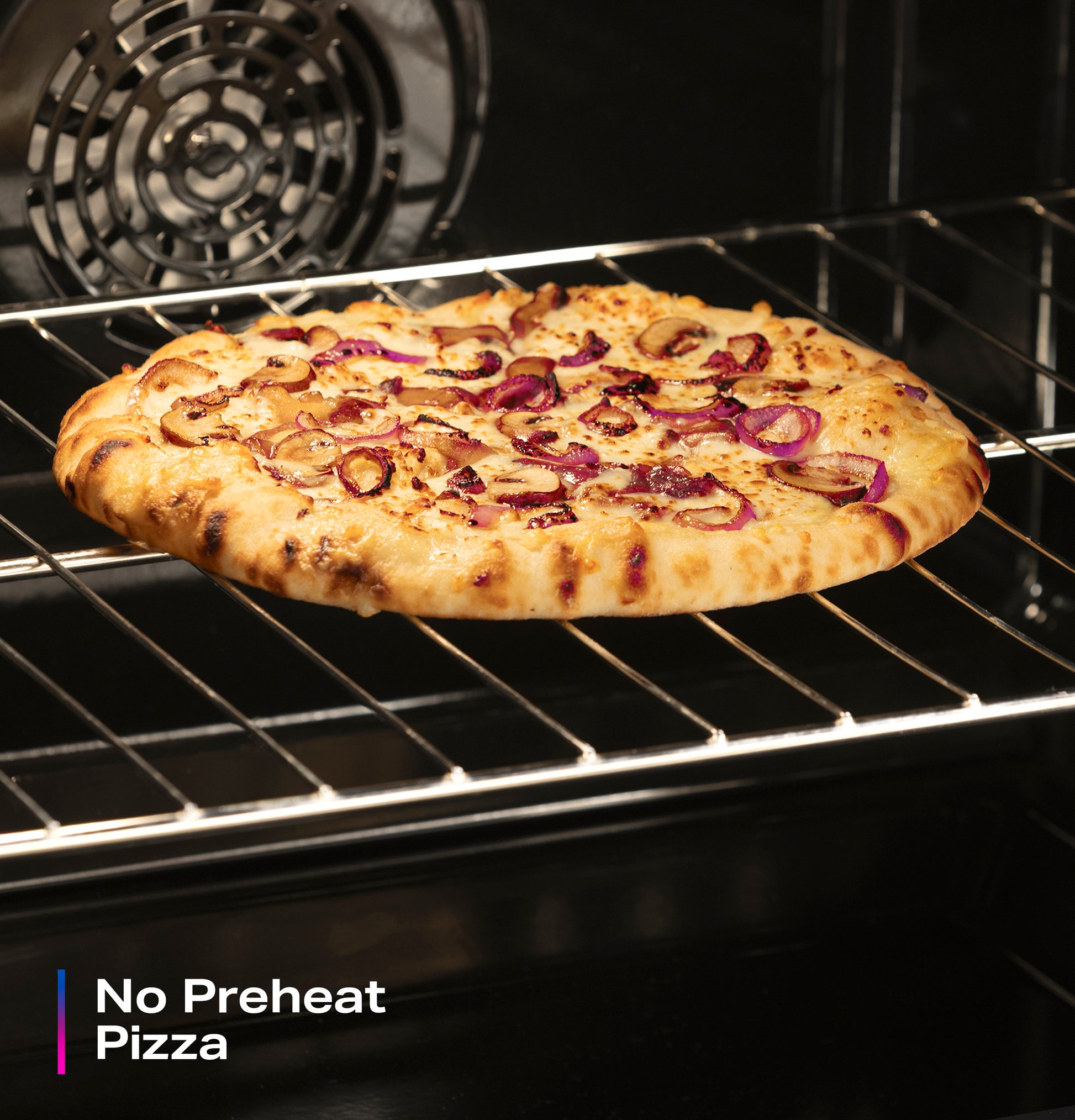Pizza with toppings baking on the rack inside an electric convection range from the Ranges & Cooktops collection.