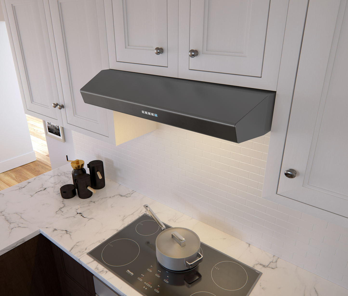 Matte black under cabinet range hood with LED lights above electric cooktop and white kitchen cabinetry in appliances collection