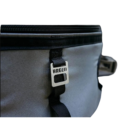 Close-up of gray padded Breeo Y Series transit case with metal logo tag, designed for outdoor living and fire pits storage