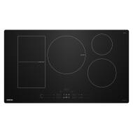 Black glass induction cooktop with four burners and touch controls in kitchen and appliances collection