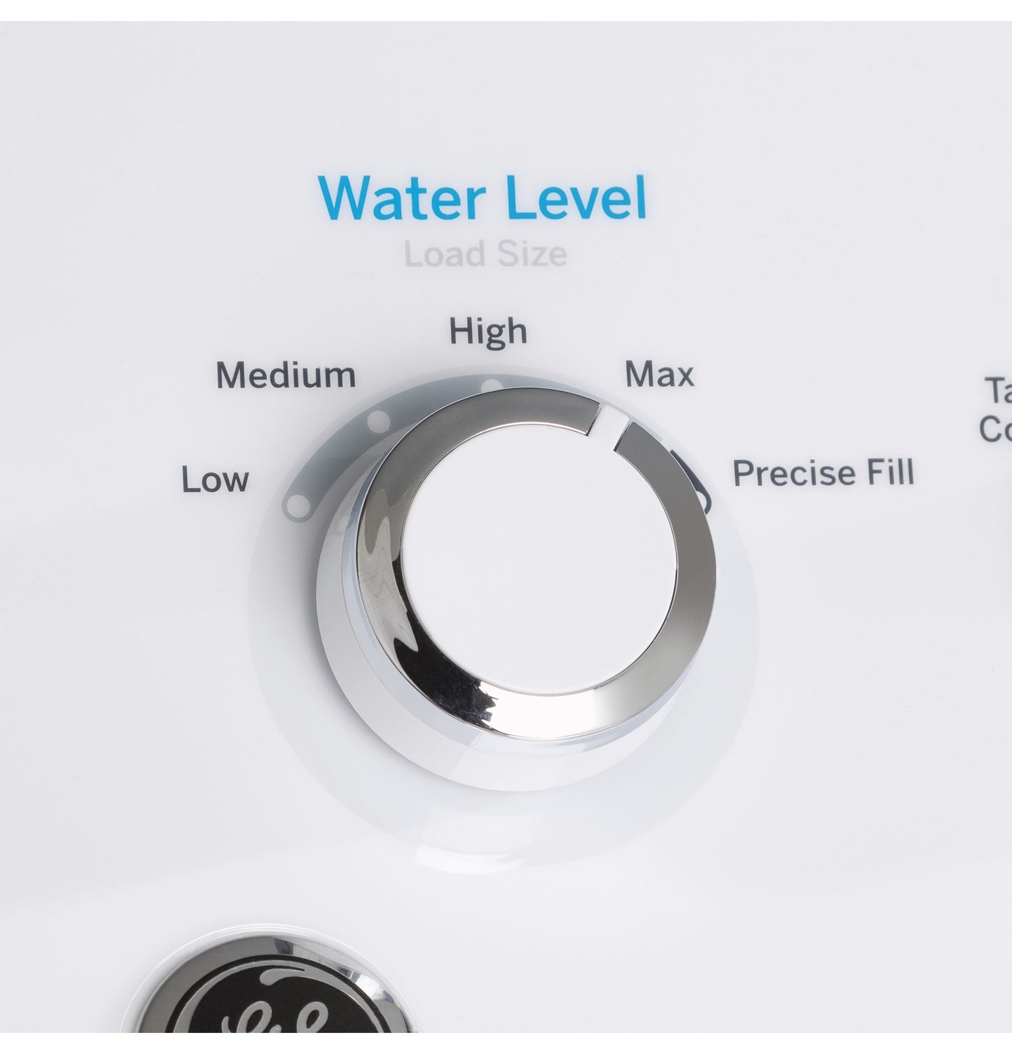 Close-up of water level control dial on washer with settings from low to max for load size adjustment