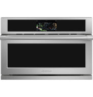 Modern stainless steel built-in wall oven with digital control panel in a contemporary kitchen setting
