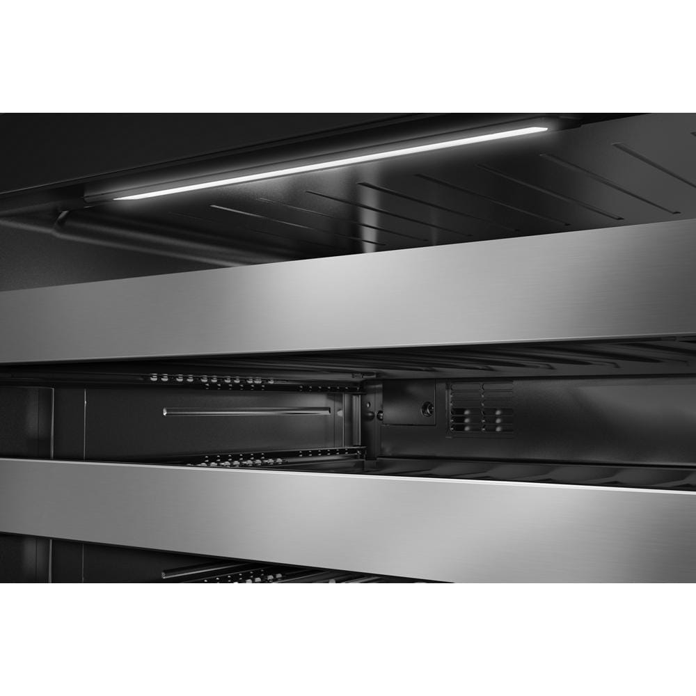 Interior view of wine cellar with full-extension metal-front racks and motion-activated LED lighting from KitchenAid appliances collection