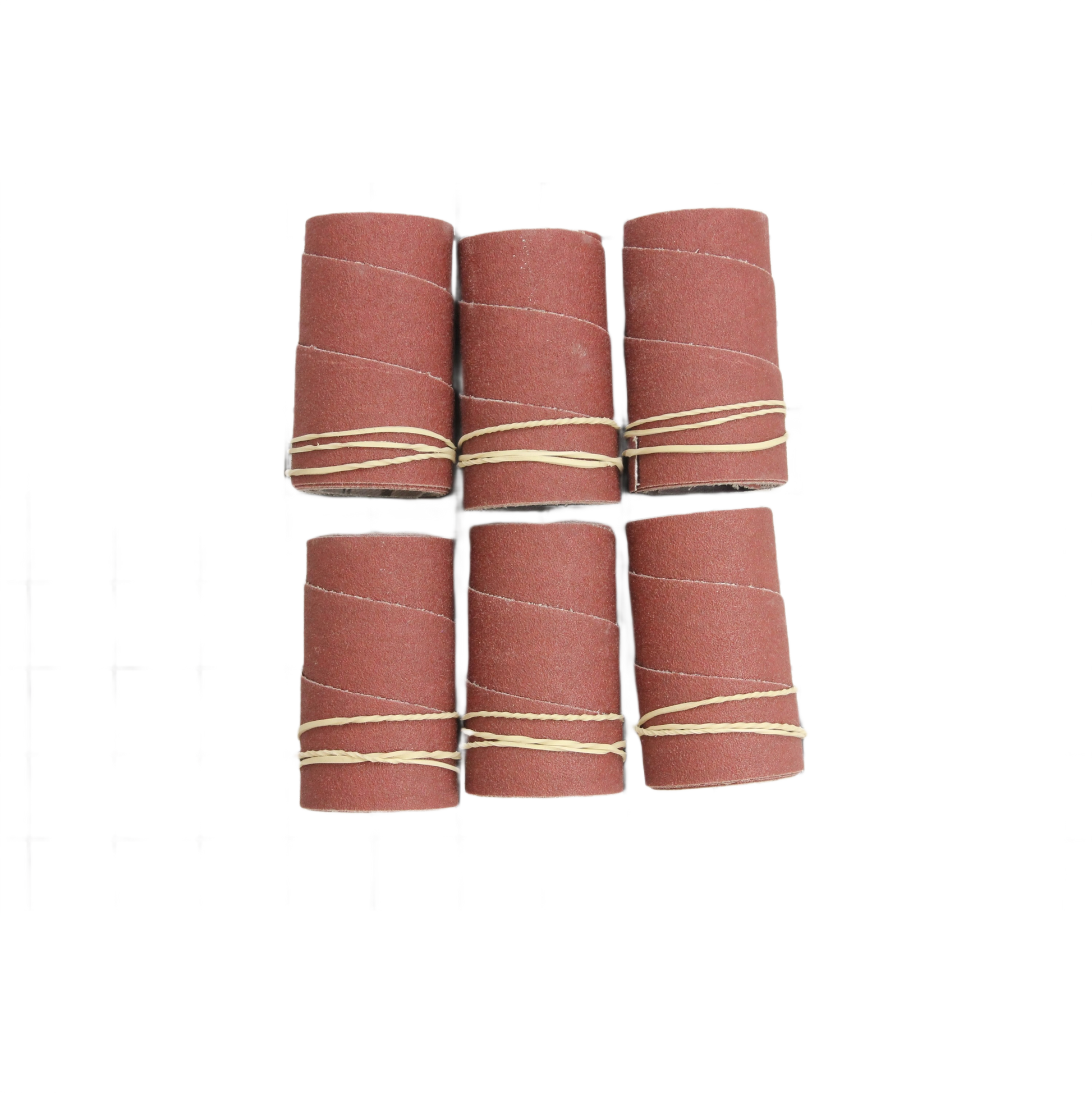 Six medium grit sandpaper strips rolled and secured with rubber bands for drum sanding tools in under $50 collection.