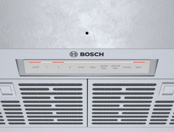 Close-up of stainless steel Bosch ventilation system control panel and mesh filters in a modern kitchen hood setup