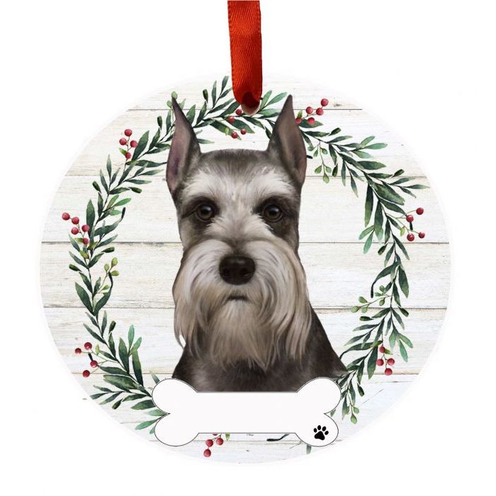 Round Christmas ornament featuring a Schnauzer face inside a festive wreath for holiday decorations under $50 collection
