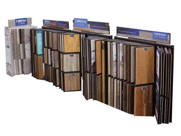 Freestanding display featuring a variety of wood-look flooring samples in different finishes and shades for home improvement projects.