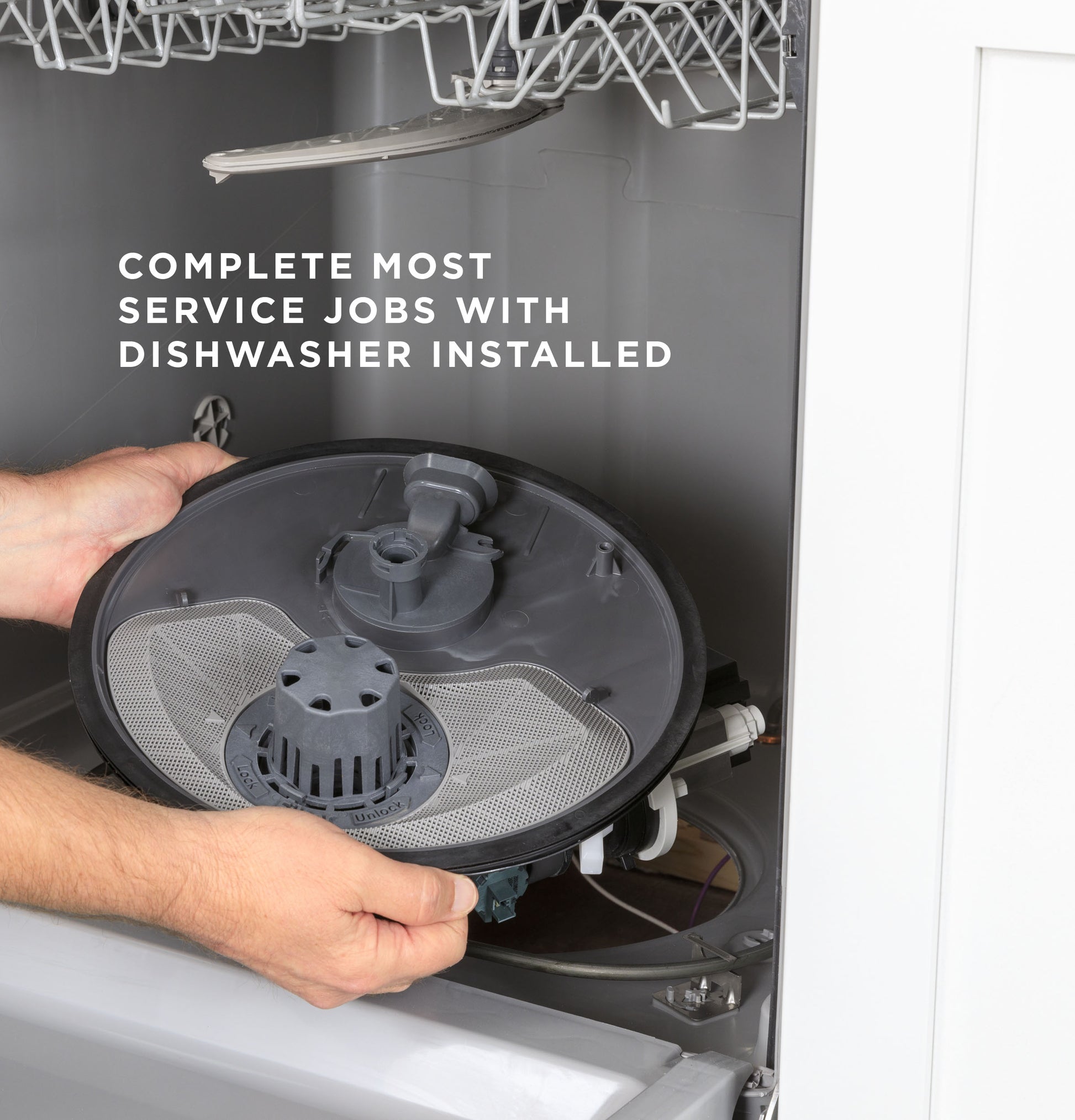 Hands removing filter assembly inside open dishwasher with text about completing service jobs with appliance installed