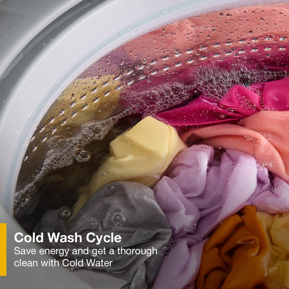 Colorful laundry soaking inside a washer drum during the cold wash cycle in a top load washer from washers & dryers collection
