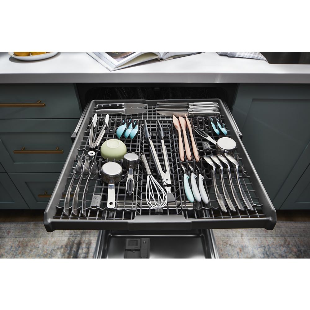 Top rack of quiet dishwasher loaded with utensils and kitchen tools in modern kitchen from appliances collection