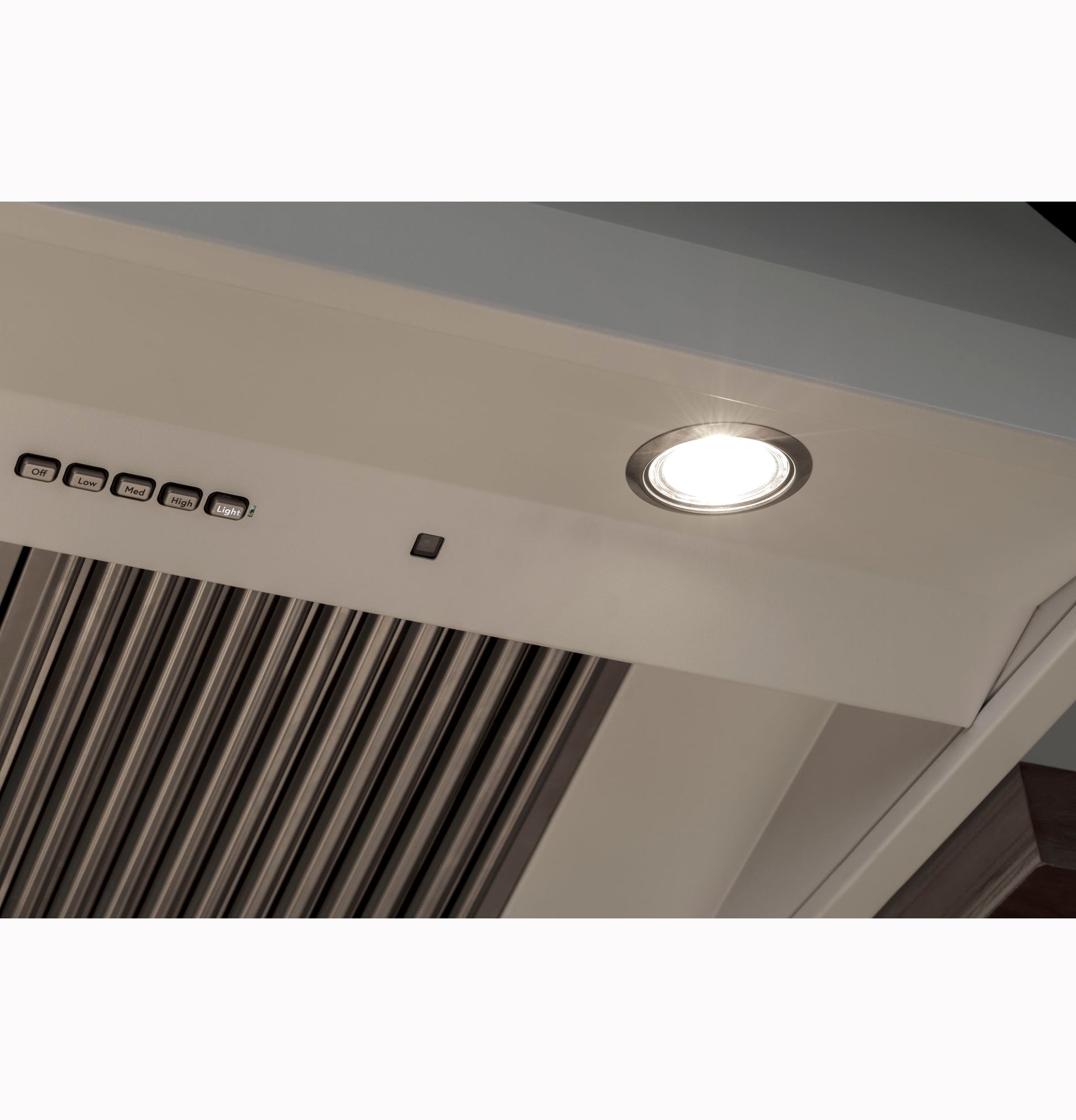 Close-up of commercial kitchen hood vent with built-in light and control buttons from Home Improvement appliances collection
