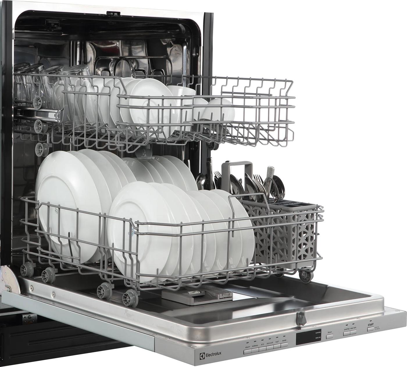 Open view of a 24-inch panel ready dishwasher from Electrolux loaded with white dishes and utensils, featured in Built-in Dishwashers at Hartville Hardware.