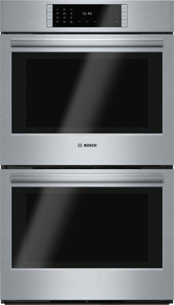 Stainless steel double wall oven with digital touch controls and steel buttons in modern kitchen appliance setting