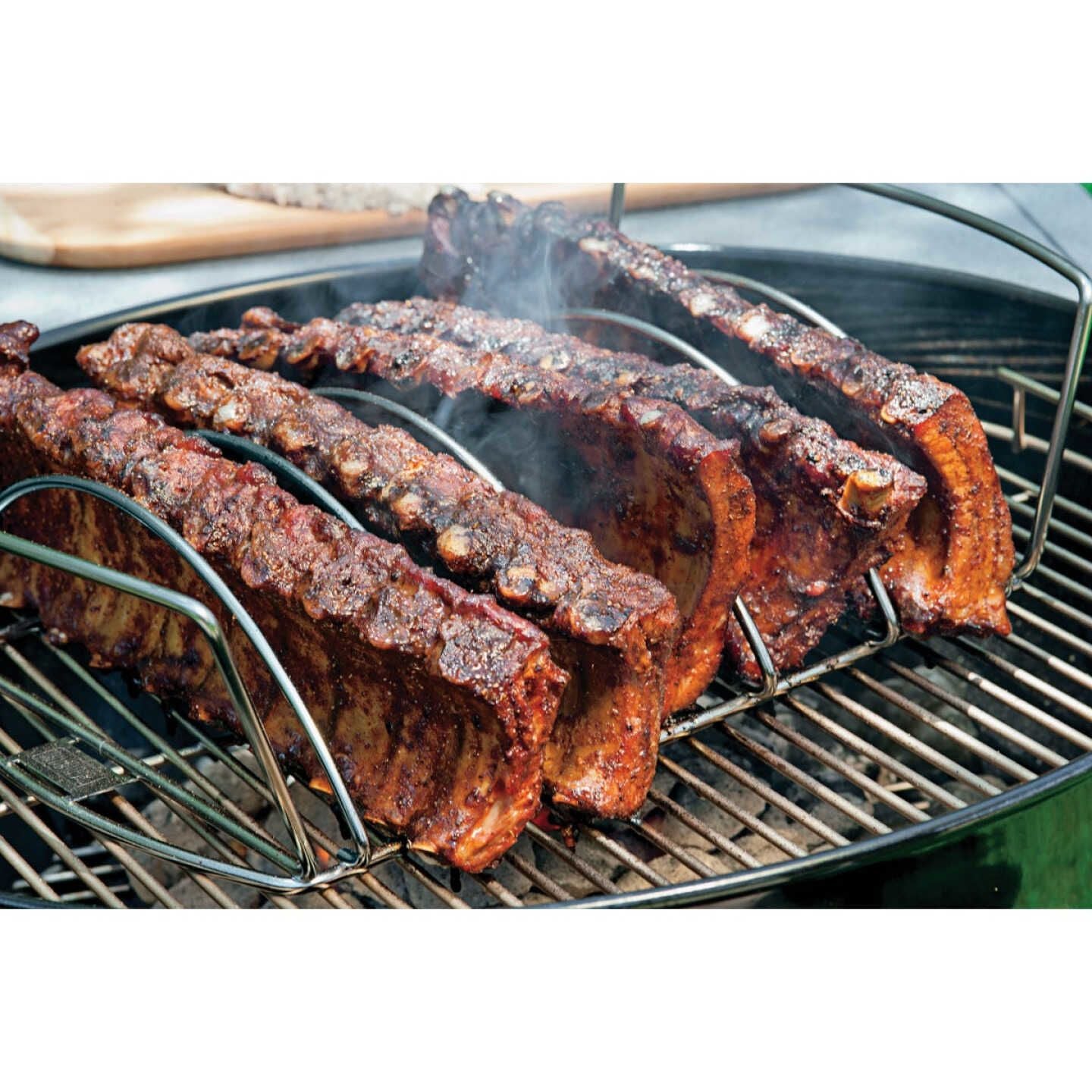 Stainless steel rib rack holding ribs upright on grill for even cooking in grilling tools and accessories collections