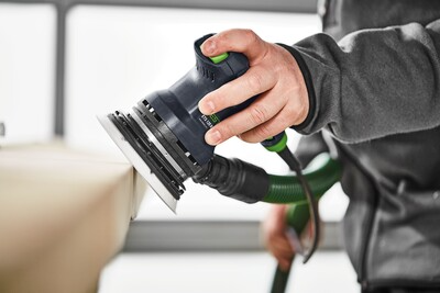 Ergonomic Festool random orbit sander with dust extraction used for precision sanding in power tools and home improvement collections