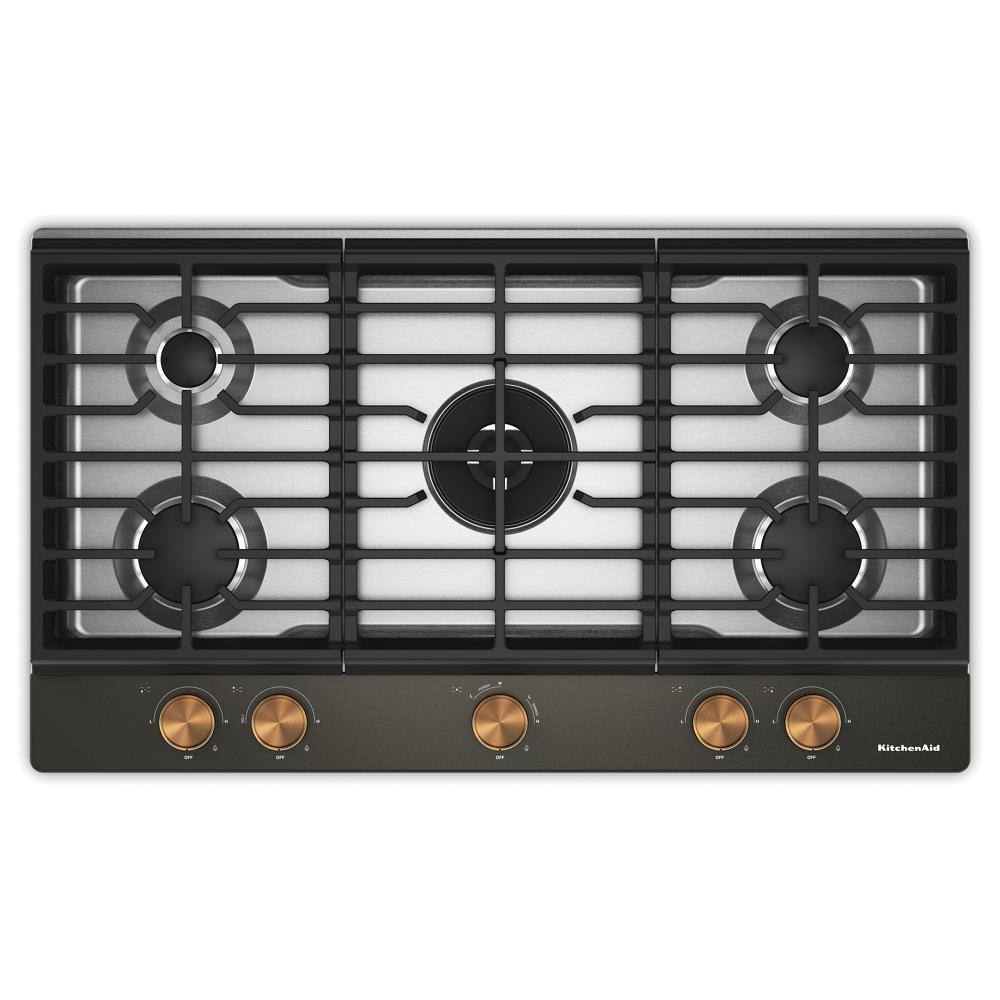 Top view of a black 36-inch gas cooktop with five burners, integrated wok grate, and bronze weighted knobs, part of Cooktops, Gas Cooktops, Kitchen & Kitchenware, and Appliances collections for home improvement.