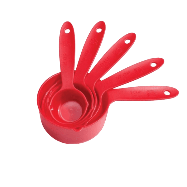Set of five red plastic measuring cups in graduated sizes for kitchenware and baking tools collection