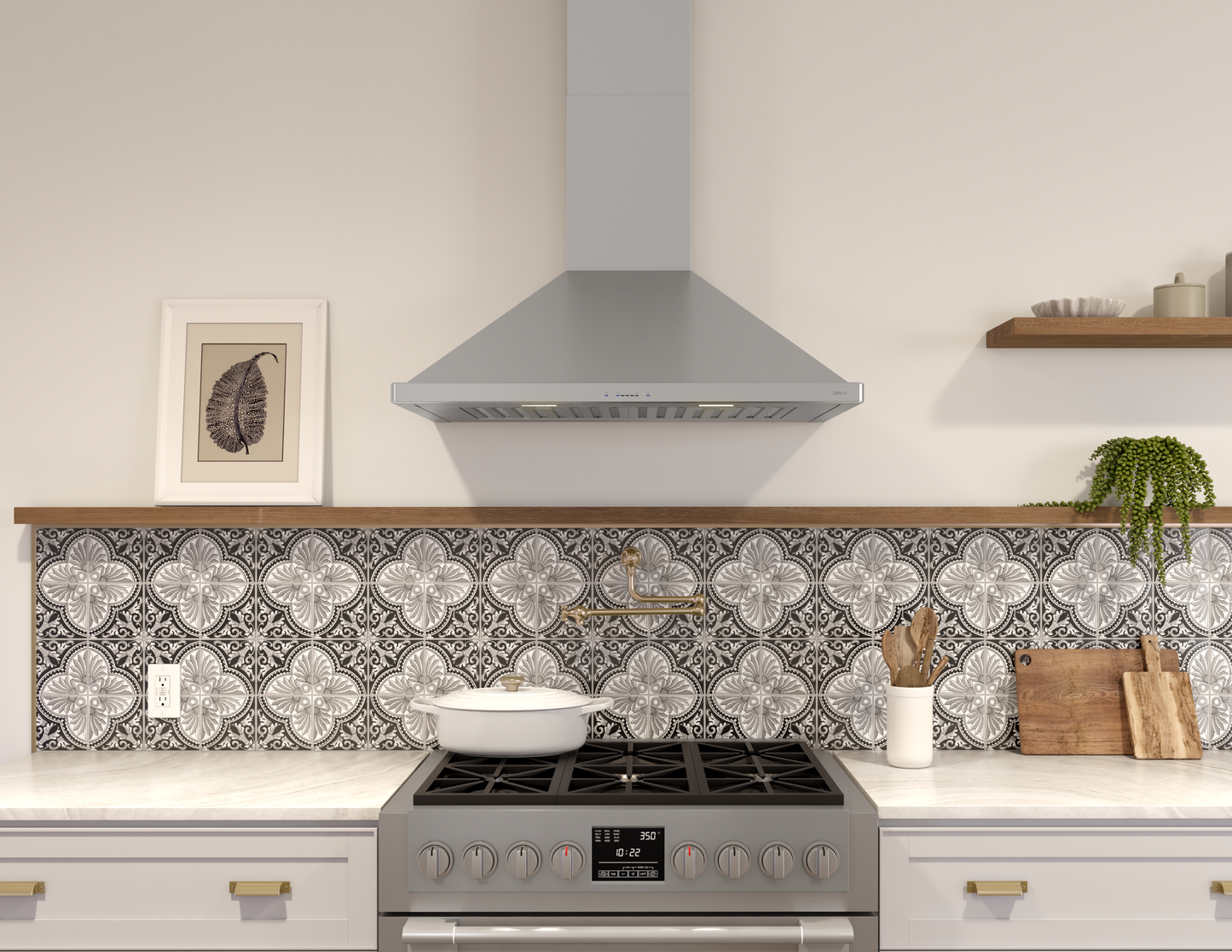 modern stainless steel chimney hood with LED lighting installed above gas range in kitchen setting
