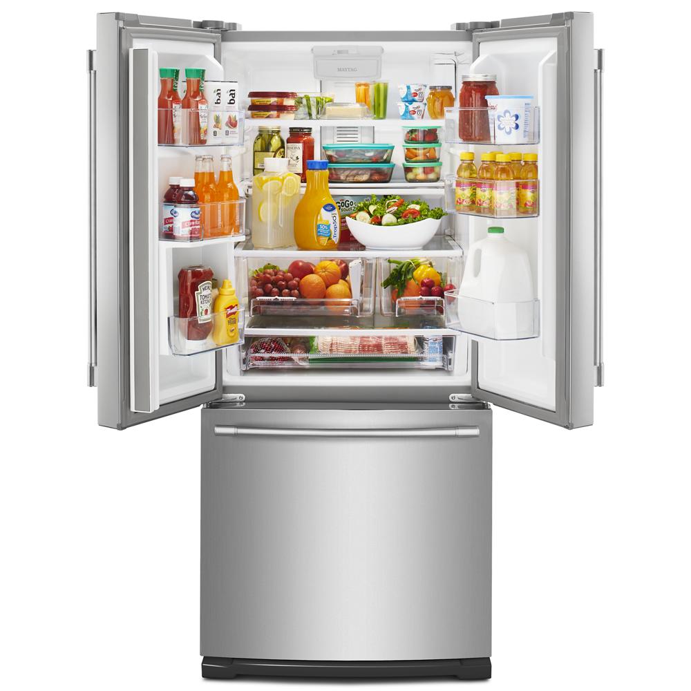 Open stainless steel French door refrigerator with organized fresh produce, beverages, and adjustable shelves in kitchen appliances collection