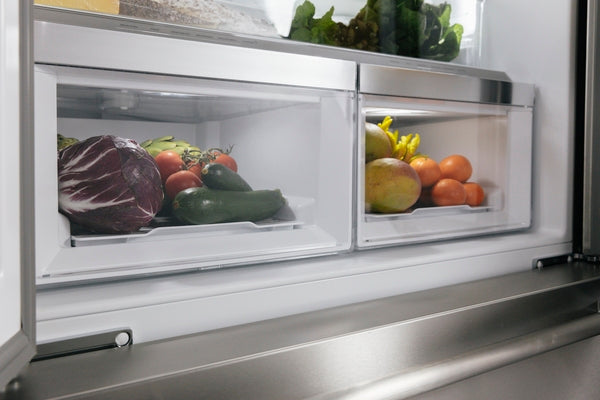 Close-up of stainless steel refrigerator crisper drawers filled with fresh vegetables in Kitchen & Kitchenware collections