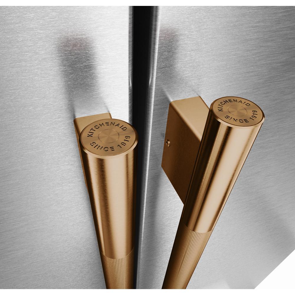 Close-up of gold-tone handles on stainless steel counter-depth refrigerator from KitchenAid appliances collection