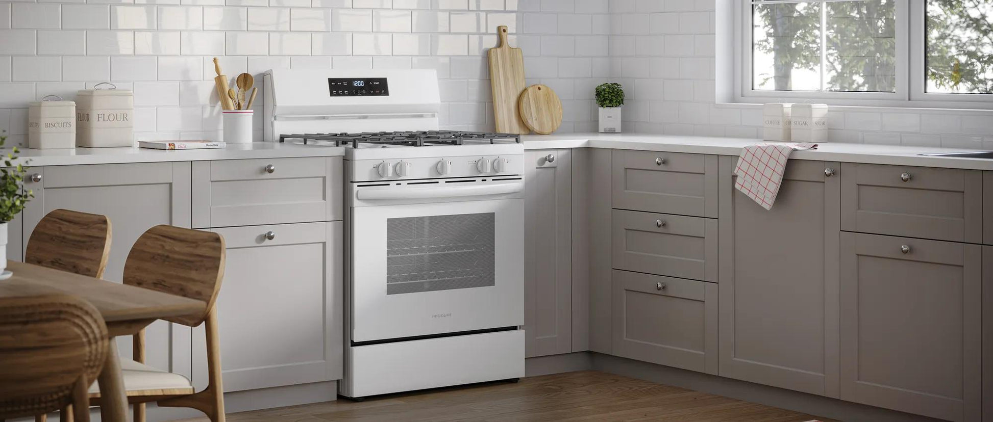 White 30-inch gas range with five burners including a powerful center oval burner in a modern kitchen setting