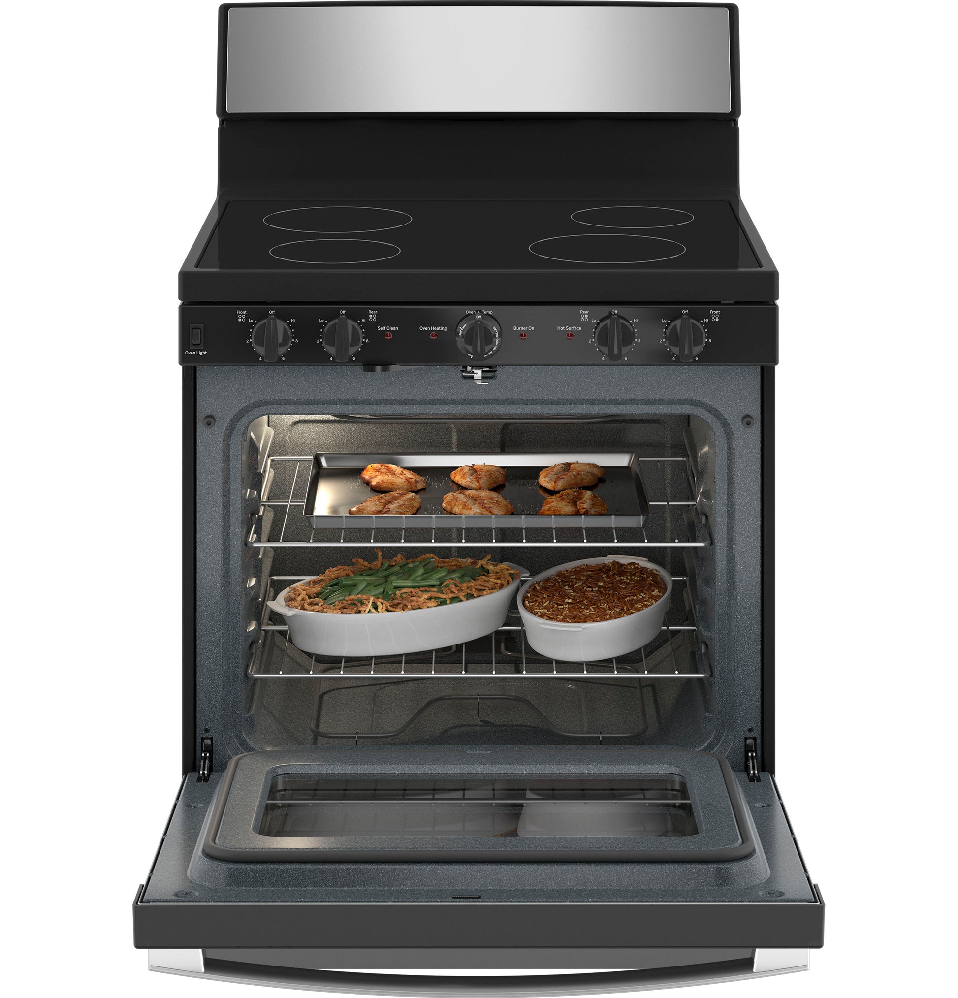 Open front view of black and stainless steel electric radiant cooktop with oven baking dishes inside kitchen appliances
