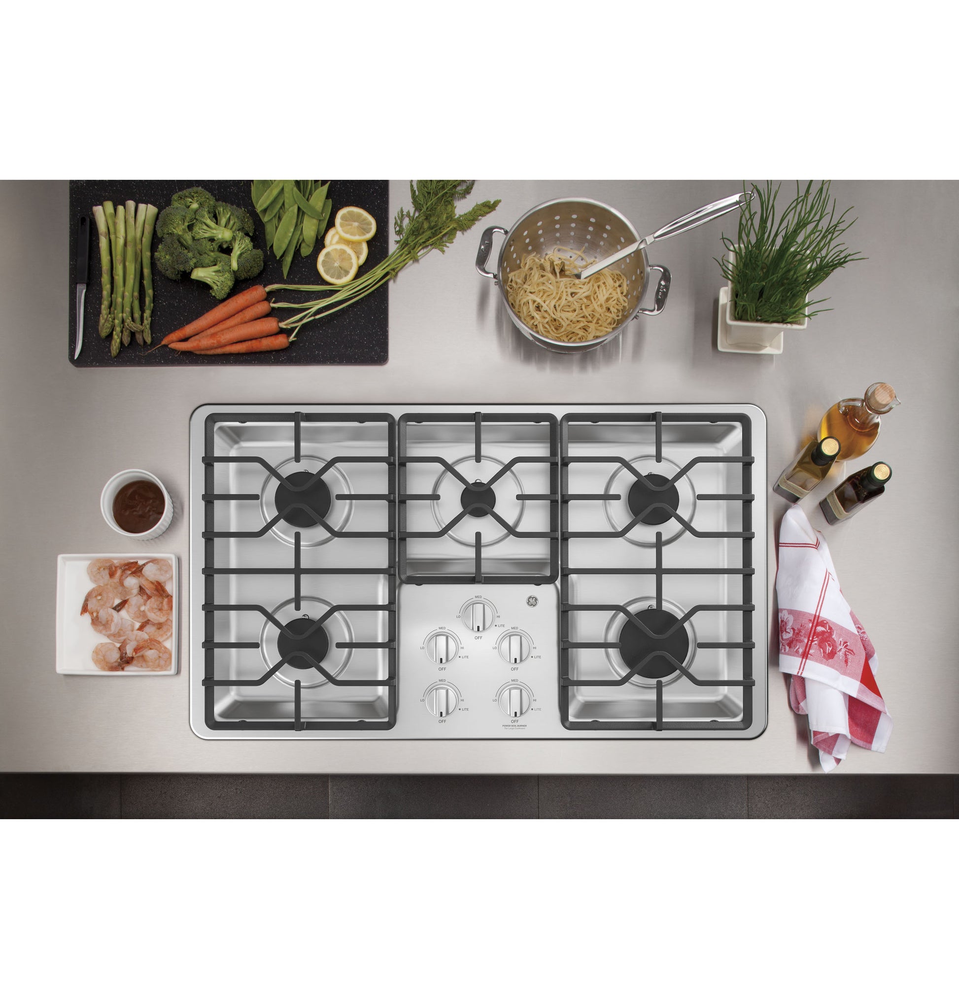Built-in stainless steel gas cooktop with five burners and dishwasher-safe grates in Cooktops and Appliances collections
