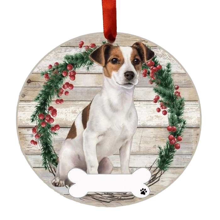 Round Christmas ornament featuring Jack Russell dog inside berry and pine wreath on wood plank background