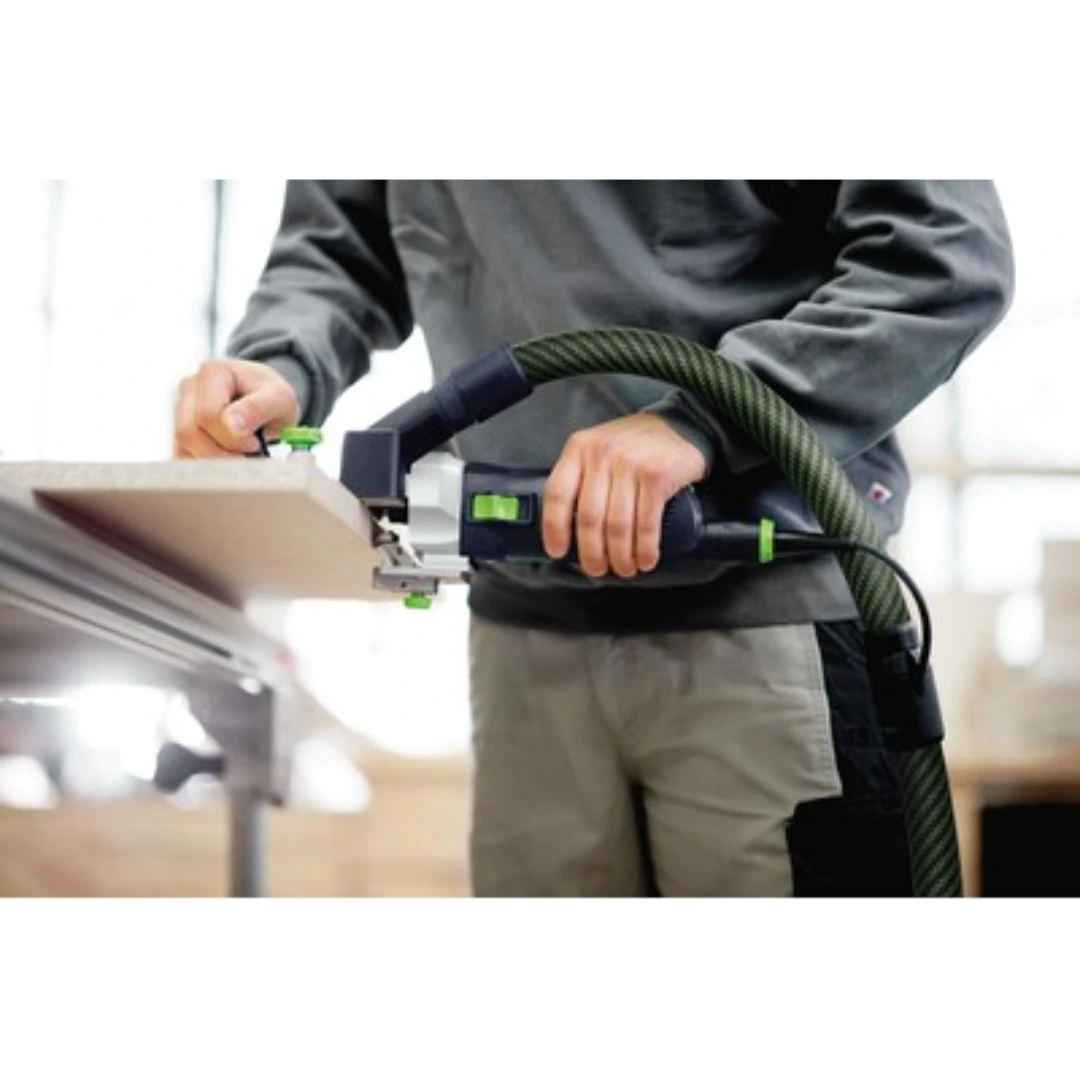 Person using Festool tool with horizontal base and dust extraction hose in woodworking tool accessories collection