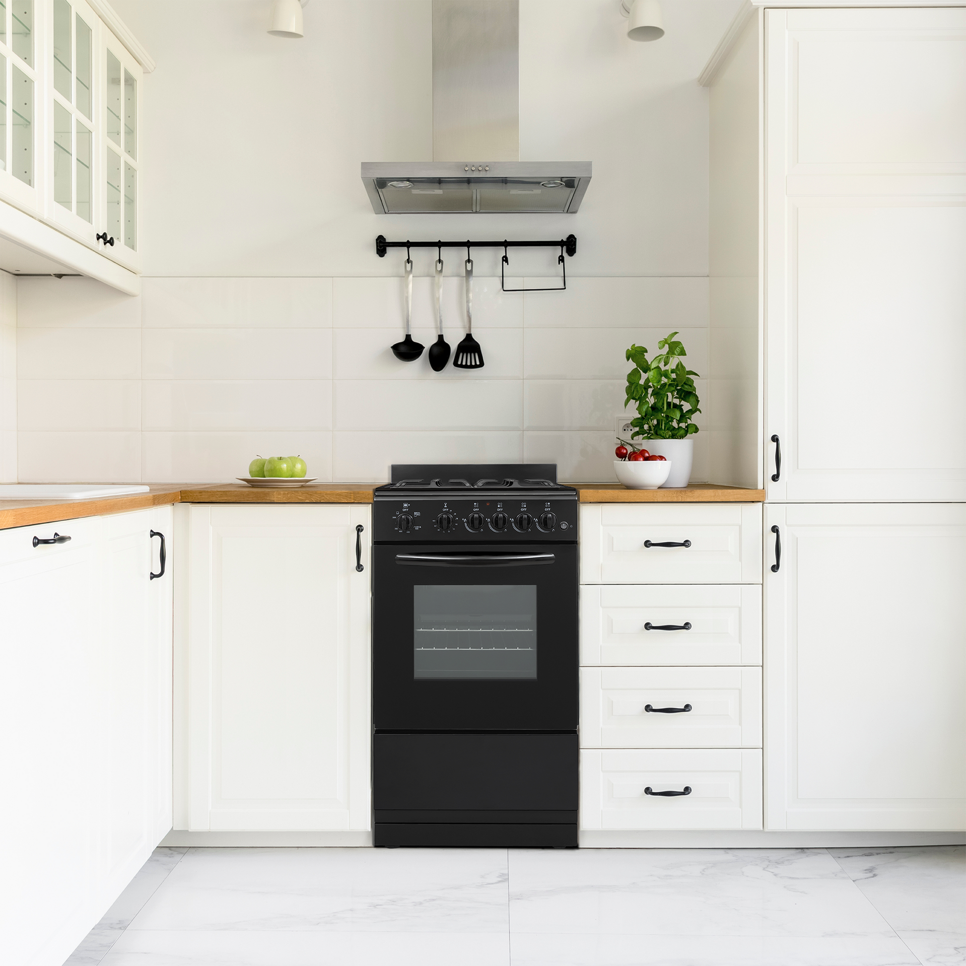 Compact black freestanding gas range with stainless steel hood, wooden countertops, white cabinetry in modern kitchen setting