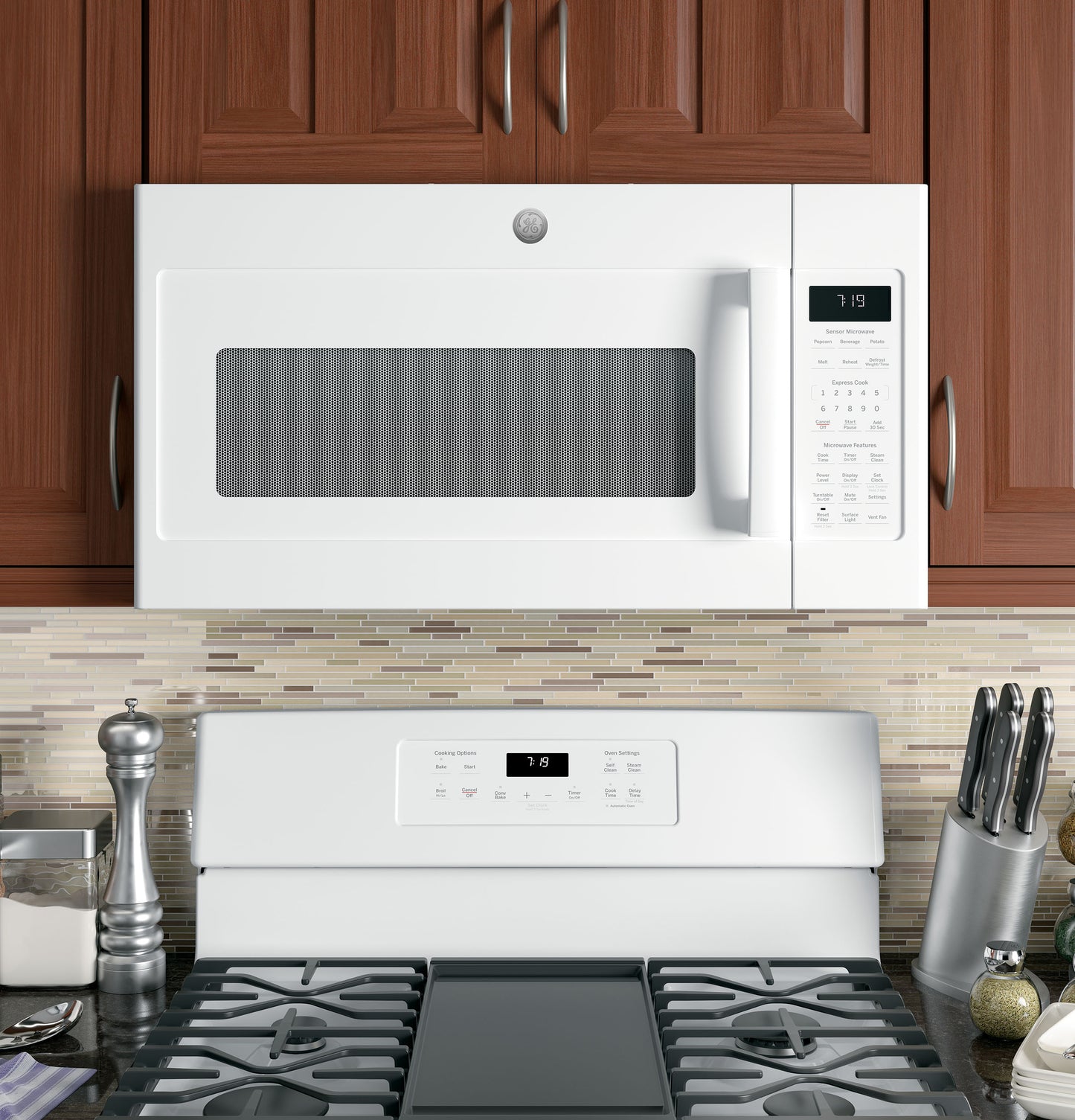 White sensor microwave installed over white stove with digital control panel in modern kitchen setting