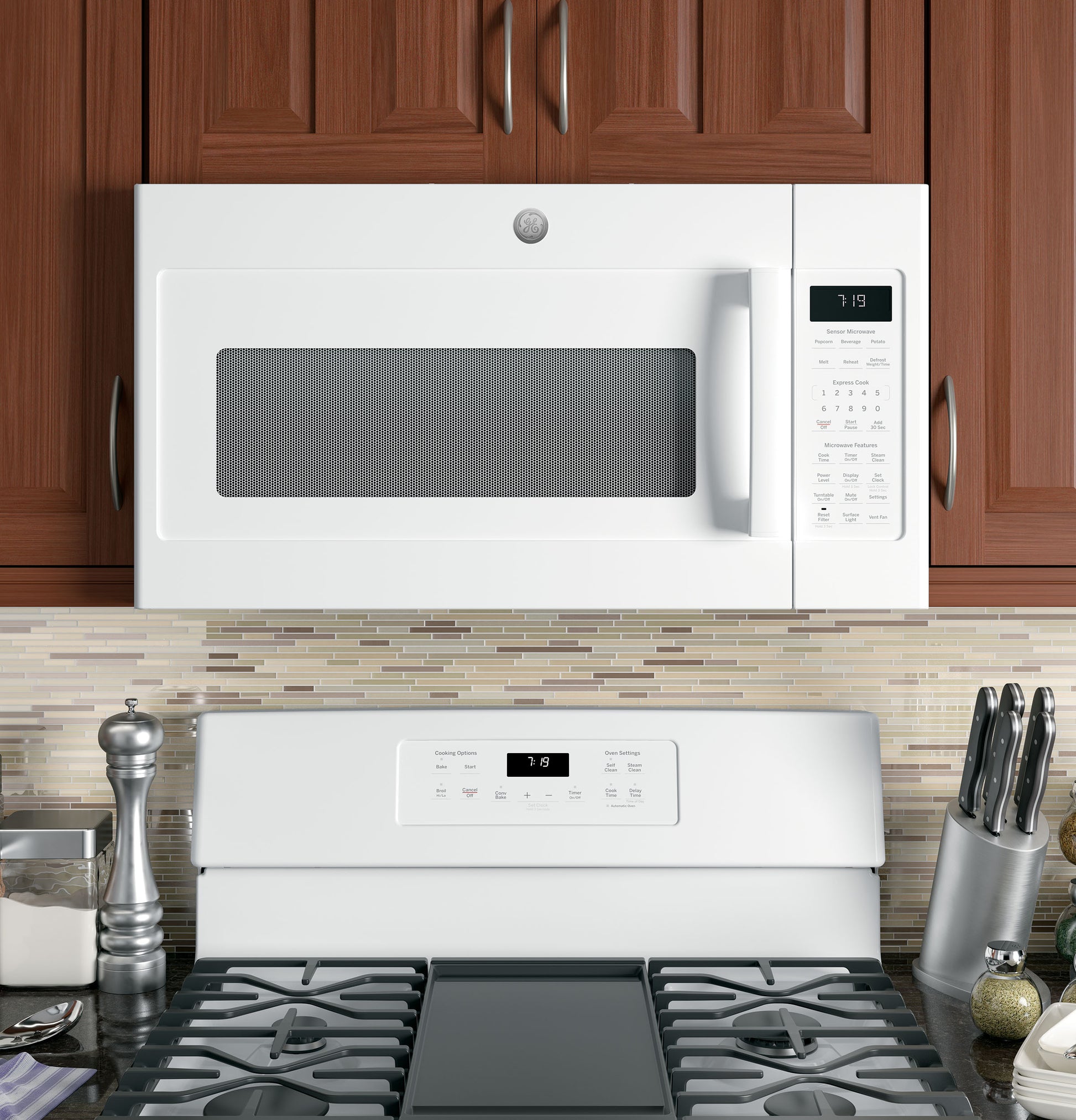 White sensor microwave installed over white stove with digital control panel in modern kitchen setting
