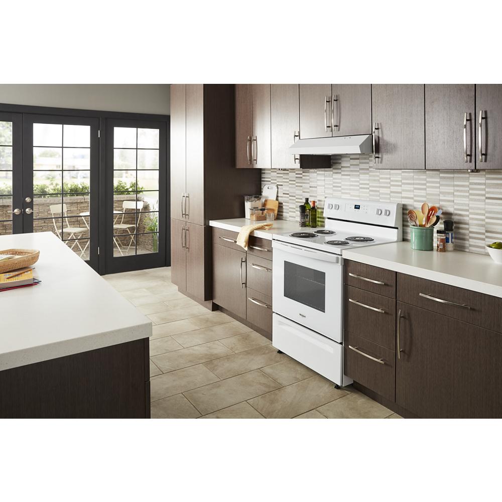 White electric range with four coil burners and digital timer in modern kitchen from Ranges & Cooktops collection